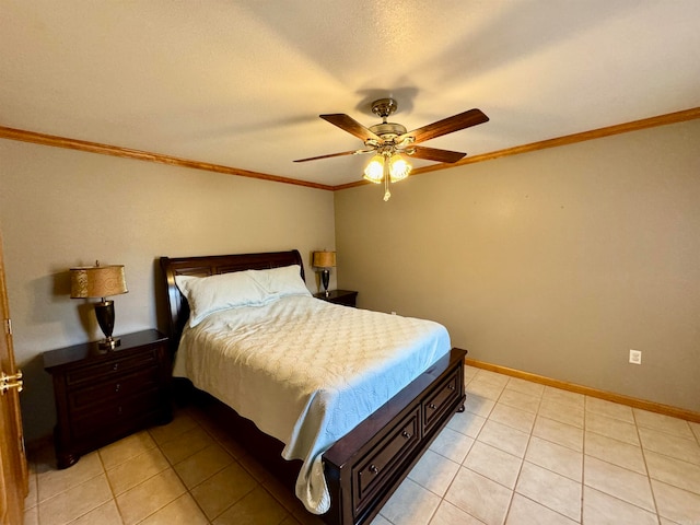 bedroom with ceiling fan, a textured ceiling, light tile patterned floors, and ornamental molding