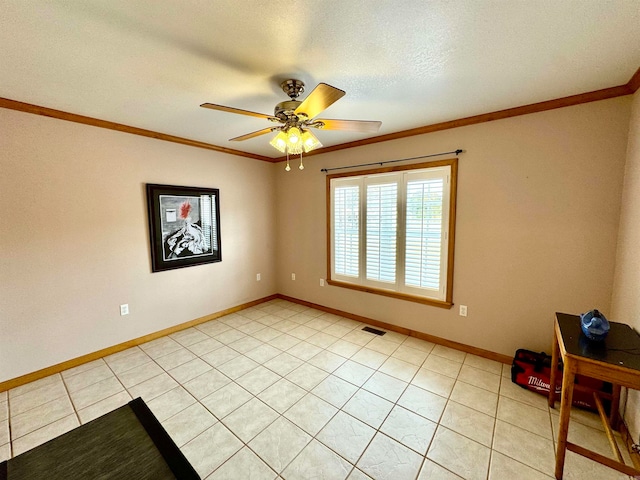 tiled empty room featuring crown molding, a textured ceiling, and ceiling fan