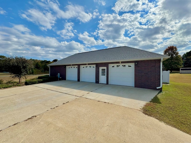 garage featuring a yard