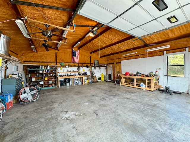 garage featuring a garage door opener and a workshop area