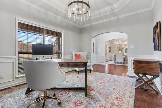 office area featuring hardwood / wood-style flooring, ornamental molding, a chandelier, and a raised ceiling