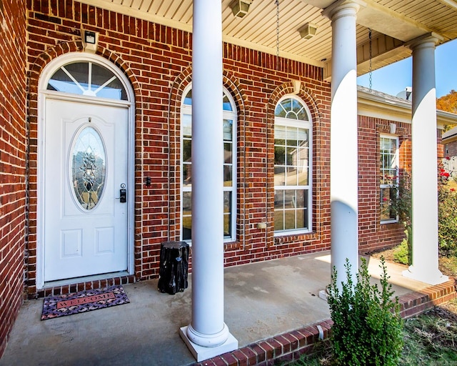 doorway to property with a porch