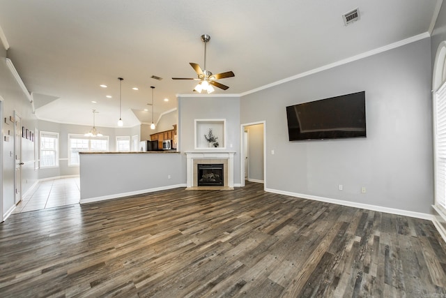18 Emma Dr, Cabot, AR 72023 - unfurnished living room with crown molding, dark wood-style flooring, ceiling fan, baseboards, and a chandelier