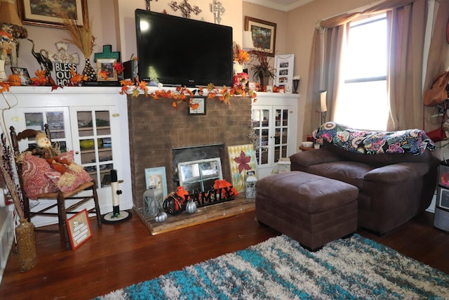 living room featuring french doors, hardwood / wood-style flooring, and ornamental molding