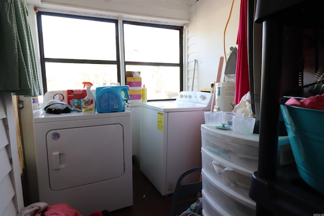 washroom featuring plenty of natural light and washing machine and dryer