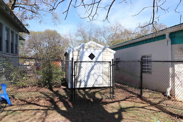 view of gate with a storage shed