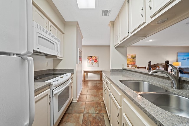 kitchen with sink and white appliances