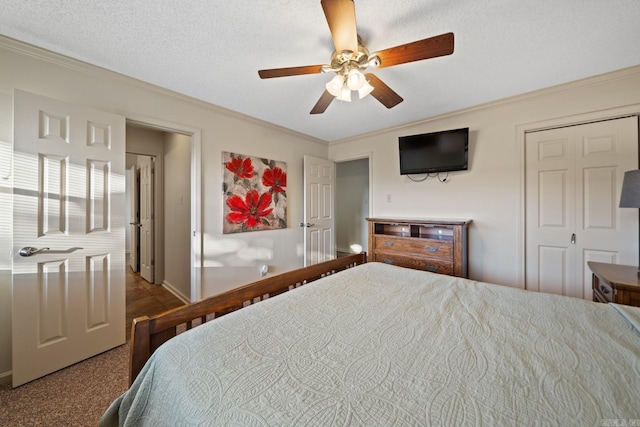 carpeted bedroom with crown molding, a textured ceiling, and ceiling fan