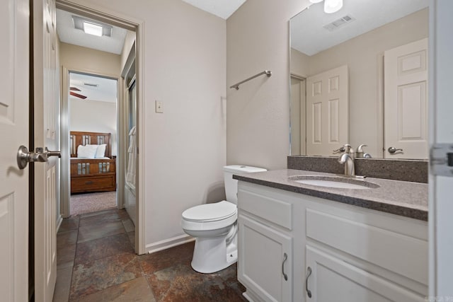 bathroom with vanity and toilet