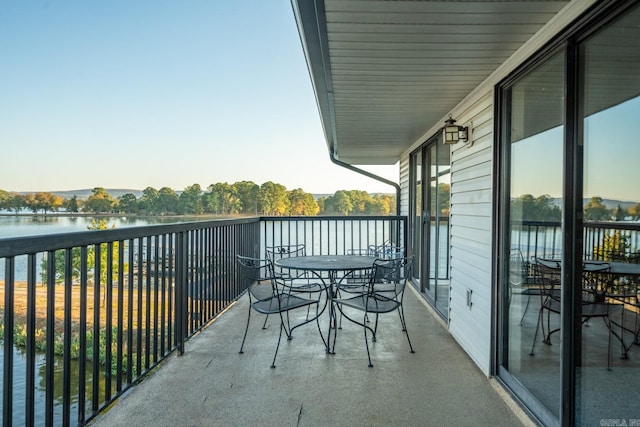 balcony featuring a water view