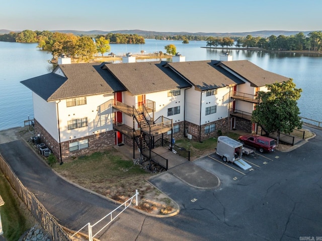 birds eye view of property with a water view