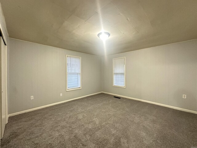1817 W 16th St, North Little Rock, AR 72114 - unfurnished room with dark carpet and baseboards