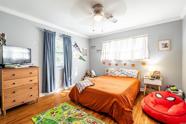 bedroom featuring ceiling fan, hardwood / wood-style flooring, and ornamental molding