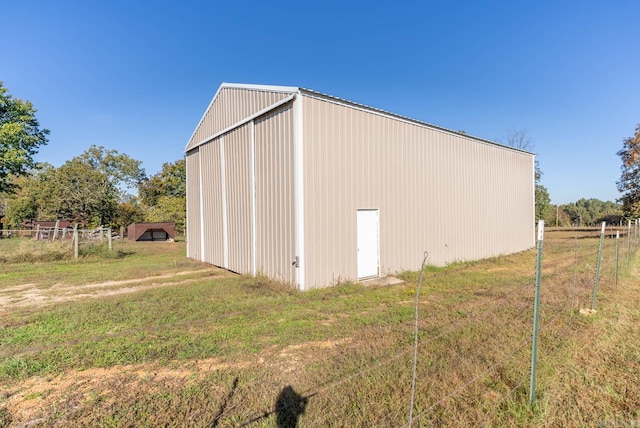 view of outbuilding with a rural view