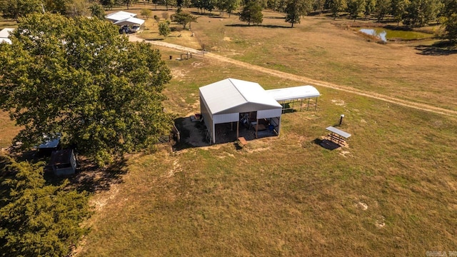 drone / aerial view featuring a rural view and a water view