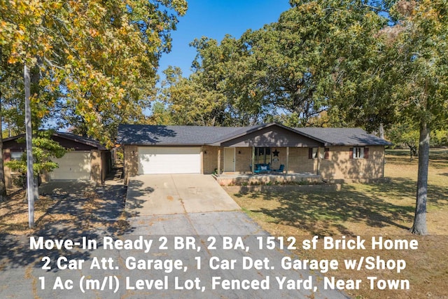 view of front of home with a garage and a front lawn