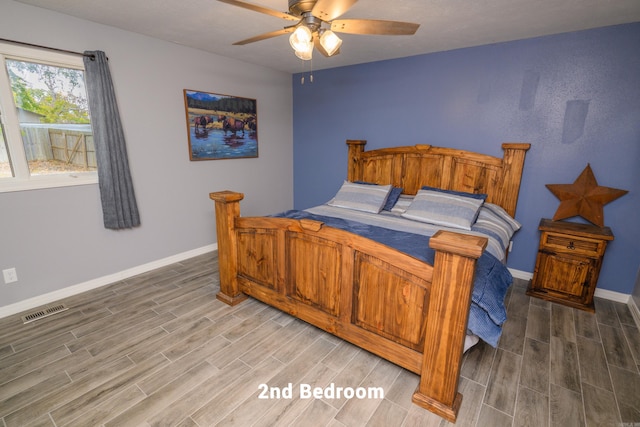 bedroom featuring hardwood / wood-style flooring and ceiling fan