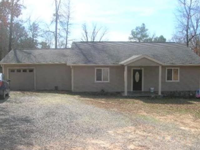 ranch-style house featuring a garage