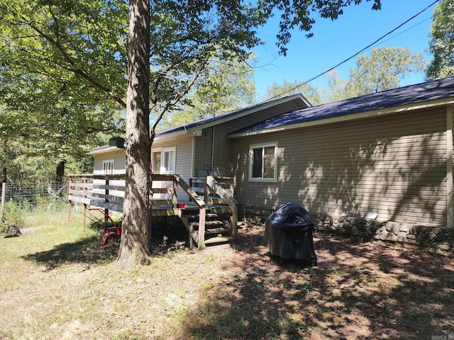 view of side of property featuring a deck