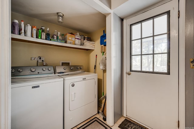 clothes washing area featuring washing machine and clothes dryer