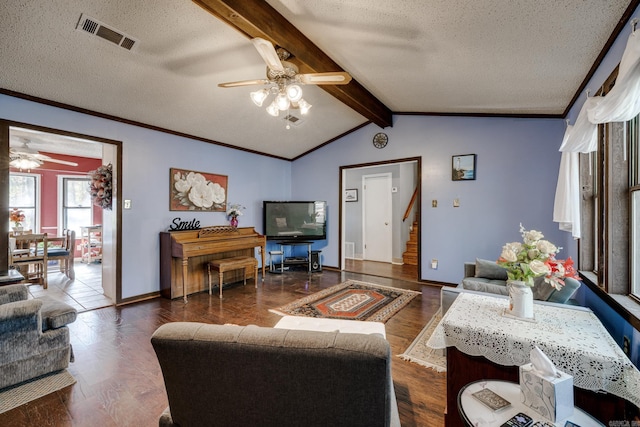 living room with a textured ceiling, lofted ceiling with beams, dark wood-type flooring, and ceiling fan