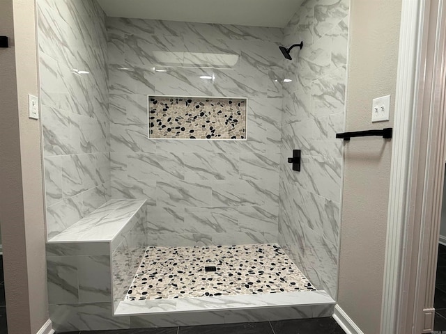 bathroom with tiled shower