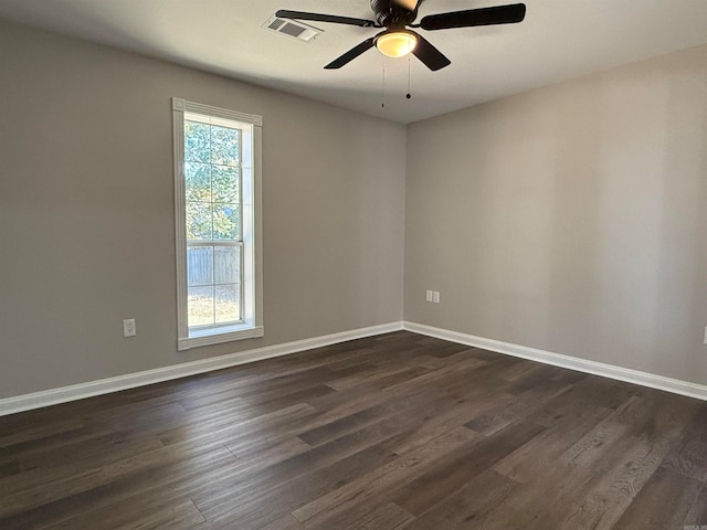 unfurnished room featuring ceiling fan and dark hardwood / wood-style flooring