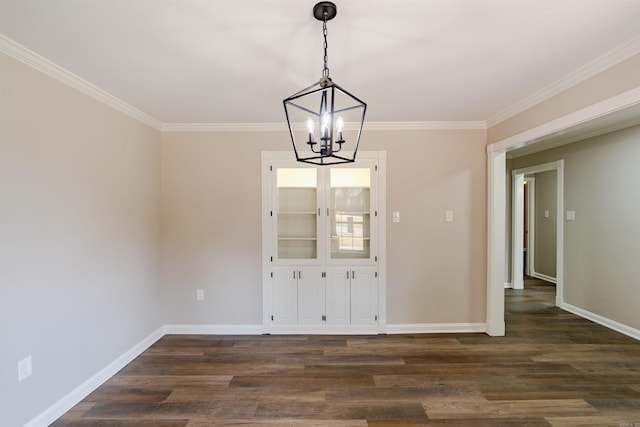 unfurnished dining area with dark wood-type flooring, a notable chandelier, and crown molding