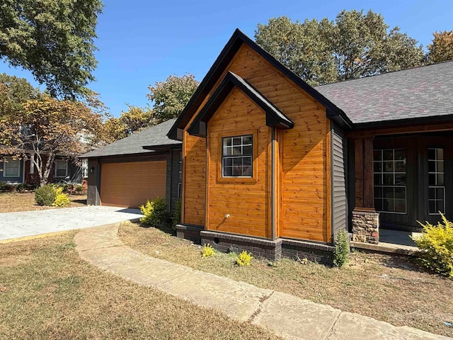 view of side of property featuring a garage