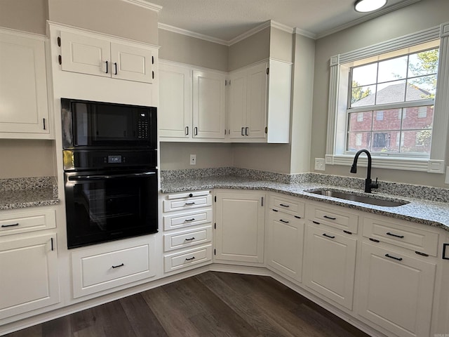 kitchen featuring white cabinetry, black appliances, sink, and dark hardwood / wood-style floors