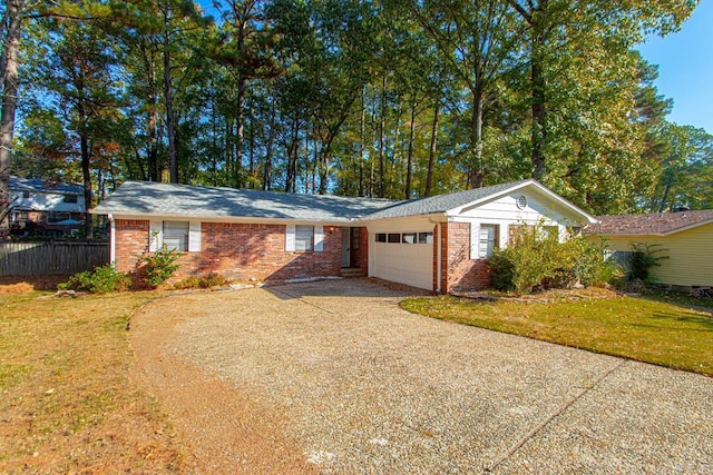 single story home with a front lawn and a garage