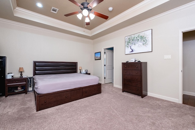 bedroom featuring ceiling fan, crown molding, a raised ceiling, and light colored carpet