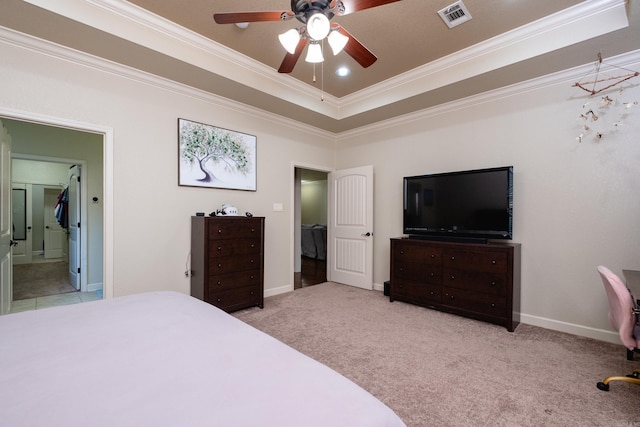 carpeted bedroom featuring ornamental molding, a raised ceiling, and ceiling fan