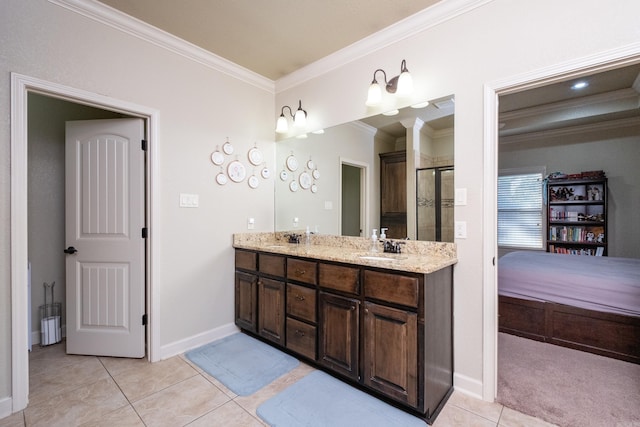 bathroom with vanity, an enclosed shower, ornamental molding, and tile patterned floors