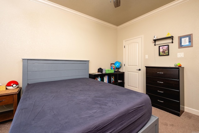 carpeted bedroom with ornamental molding and ceiling fan