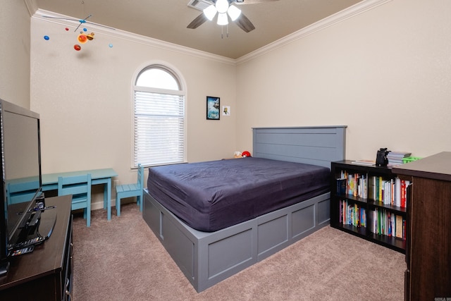 carpeted bedroom featuring ceiling fan and ornamental molding