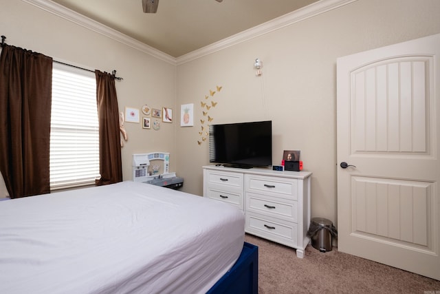 carpeted bedroom with ornamental molding and ceiling fan