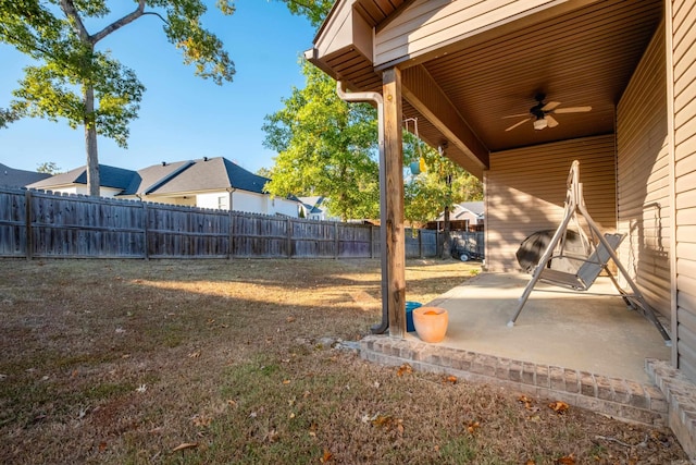 view of yard with a patio area and ceiling fan