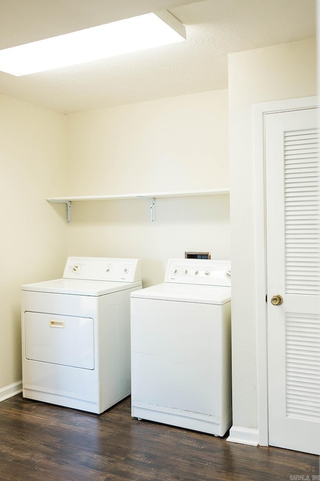 laundry area featuring dark hardwood / wood-style floors and separate washer and dryer