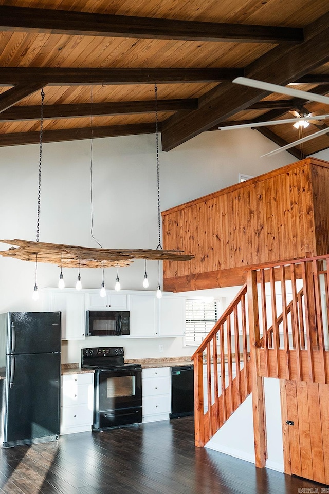 kitchen with black appliances, white cabinetry, beamed ceiling, high vaulted ceiling, and dark hardwood / wood-style floors