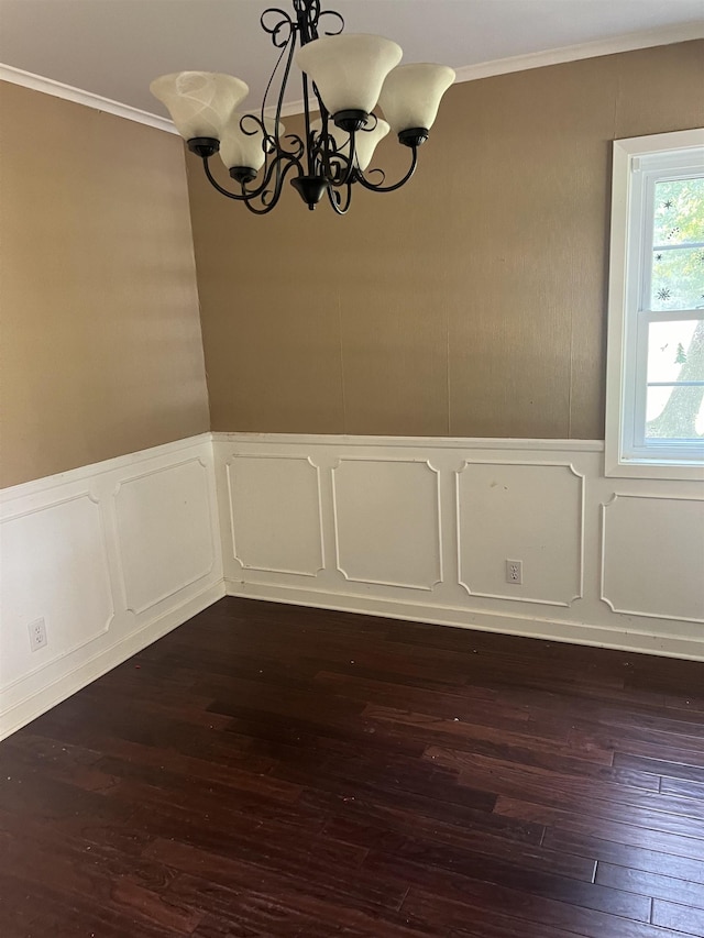 unfurnished dining area with crown molding, dark hardwood / wood-style floors, and a notable chandelier