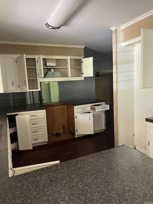 kitchen with white cabinetry and crown molding