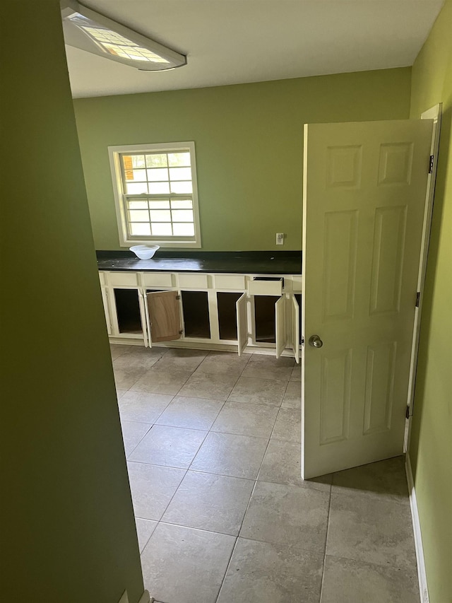 interior space with light tile patterned floors