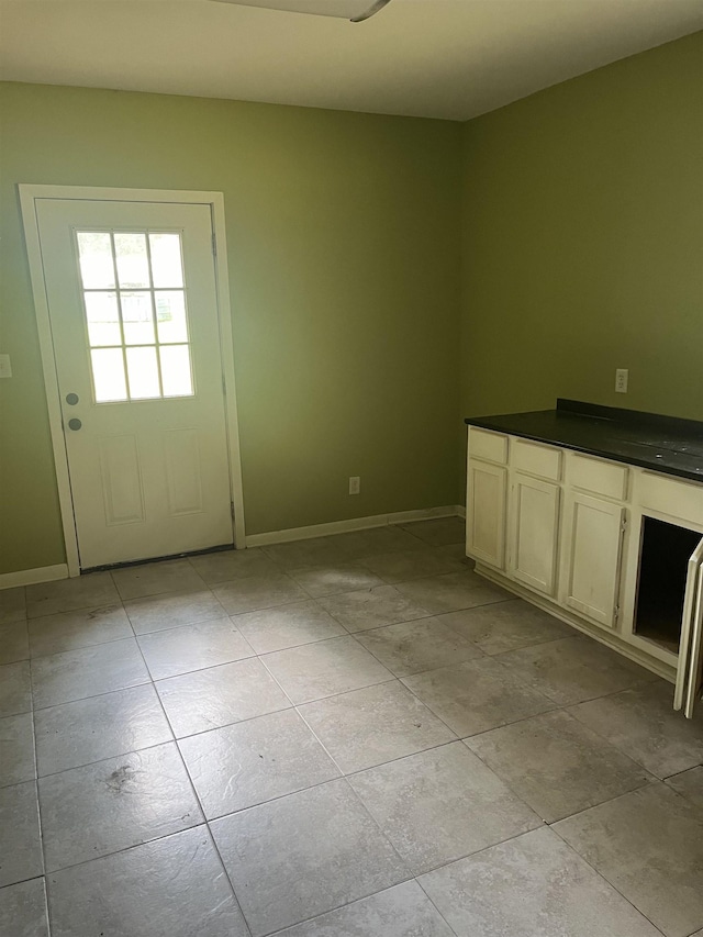 interior space with light tile patterned floors