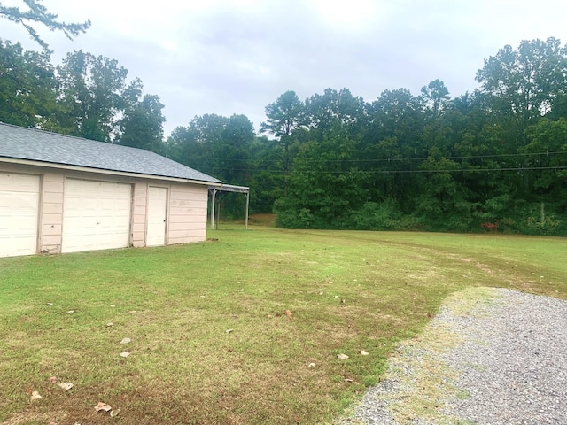 view of yard featuring a garage