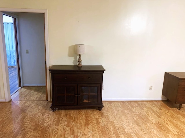 hall with light wood-type flooring