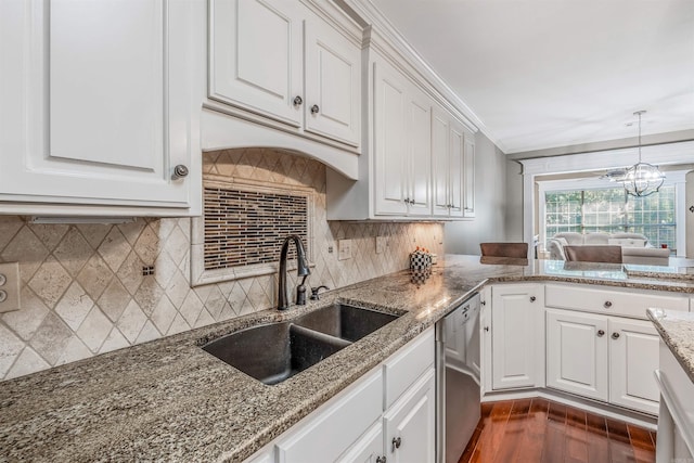 kitchen with dark wood-type flooring, white cabinetry, stainless steel dishwasher, and sink