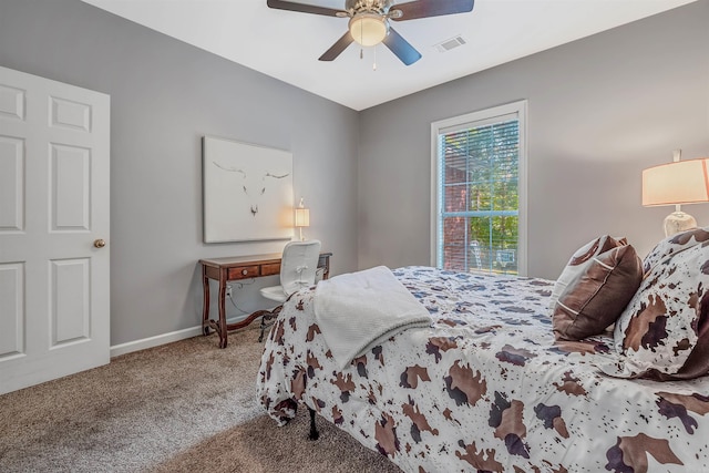 bedroom featuring ceiling fan and carpet