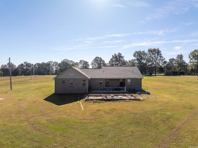 back of house featuring a yard and a patio area