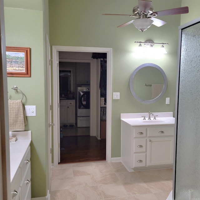 bathroom featuring vanity, washer / clothes dryer, hardwood / wood-style flooring, and ceiling fan